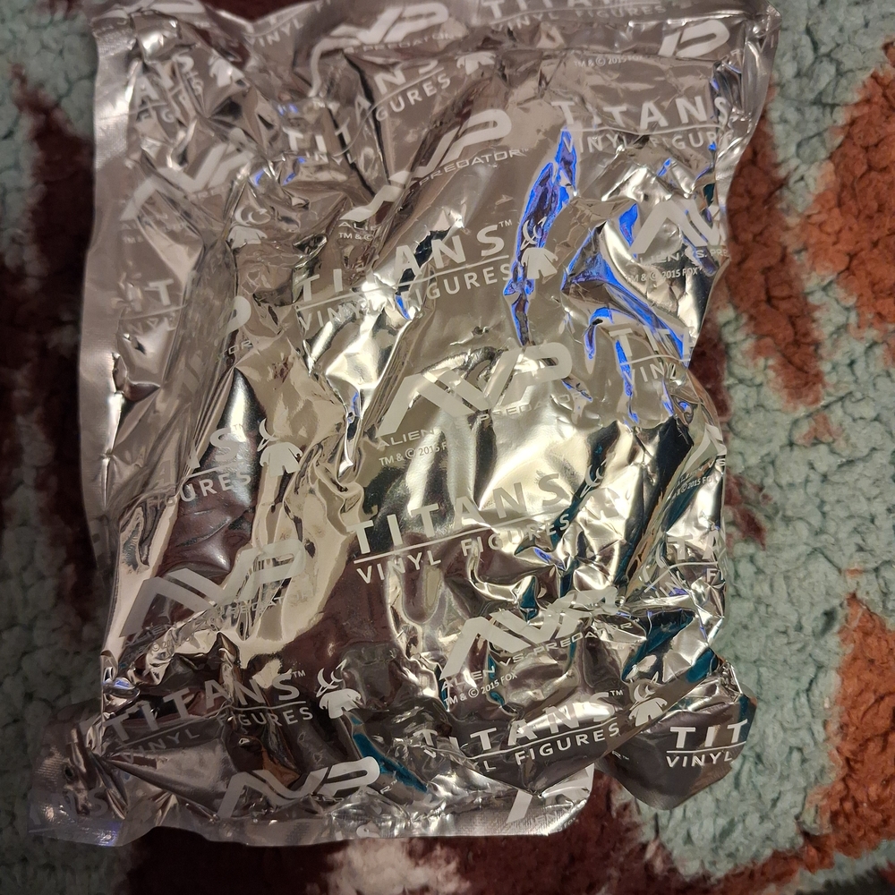 Titan Vinyl Figures Silver Packaging